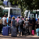 Tourists are seen gathered as they board buses leaving for the airport a day after the country declared a state of emergency, in Banjul, Gambia January 18, 2017.